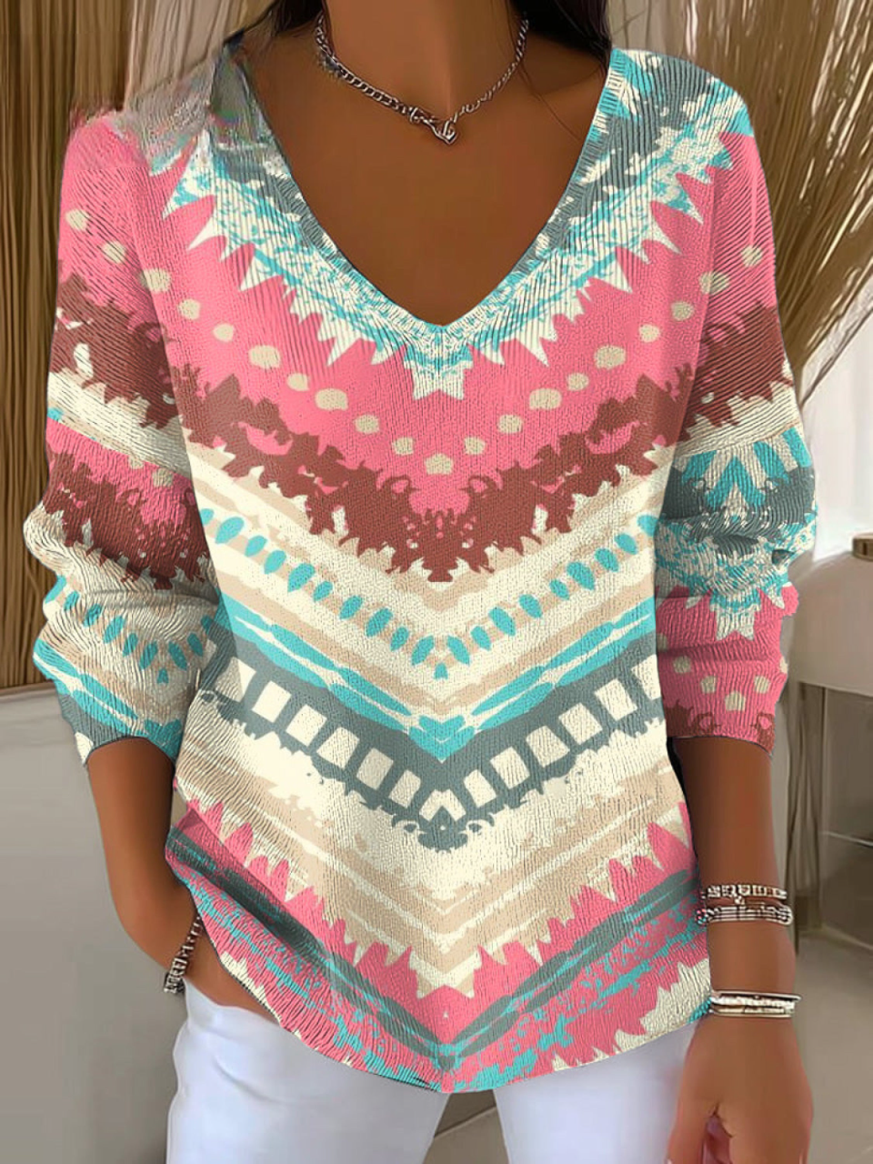 Damski kolorowy sweter z nieregularnym wzorem w paski